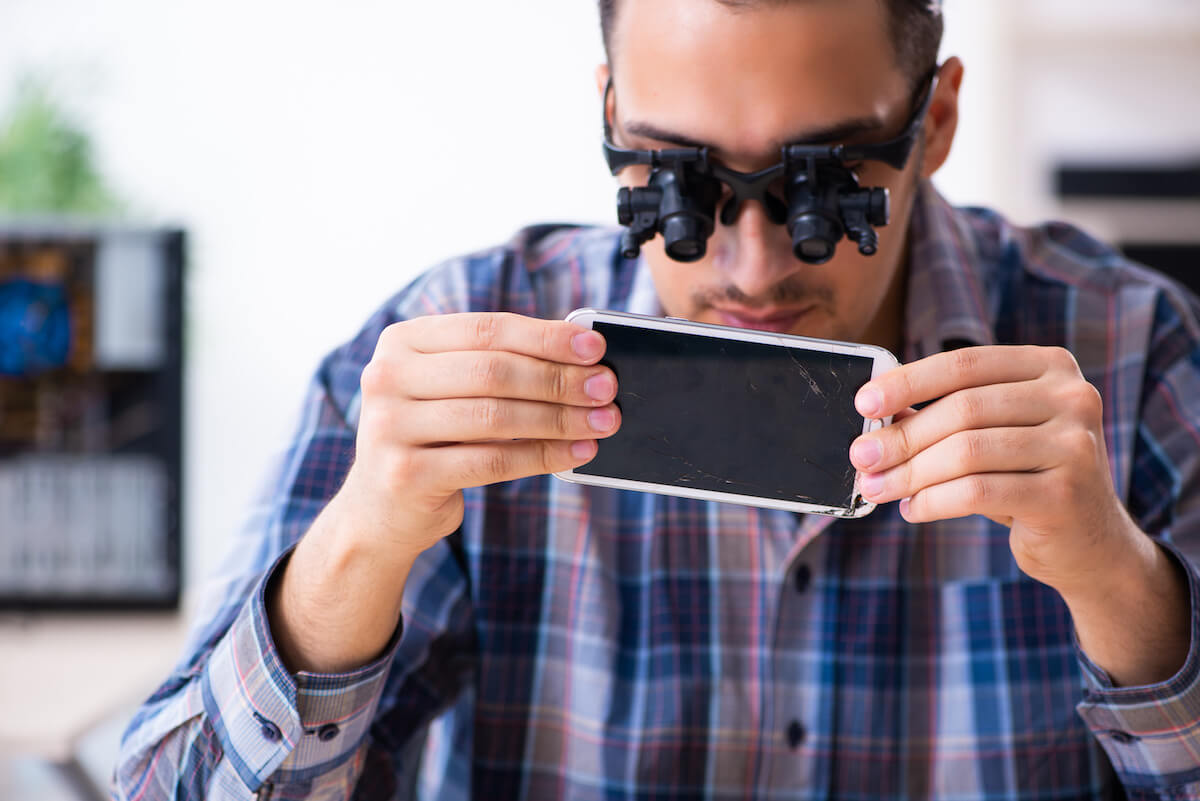 Technician repairing a phone